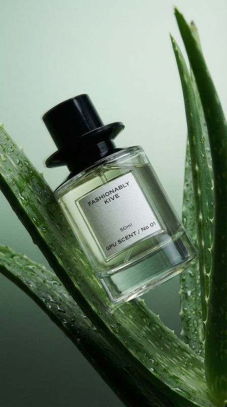 a bottle of perfume sitting on top of a plant