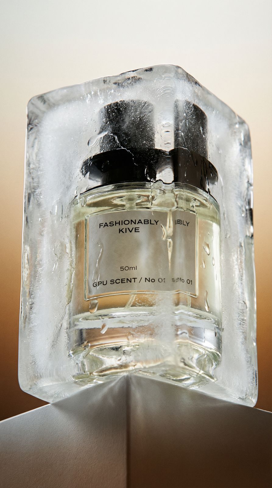 a bottle of perfume sitting on top of an ice block