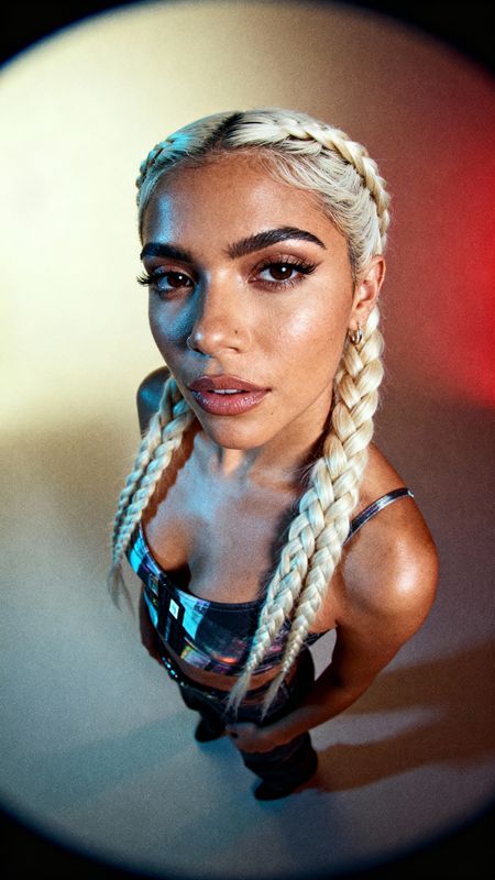 a woman with long blonde hair and braids