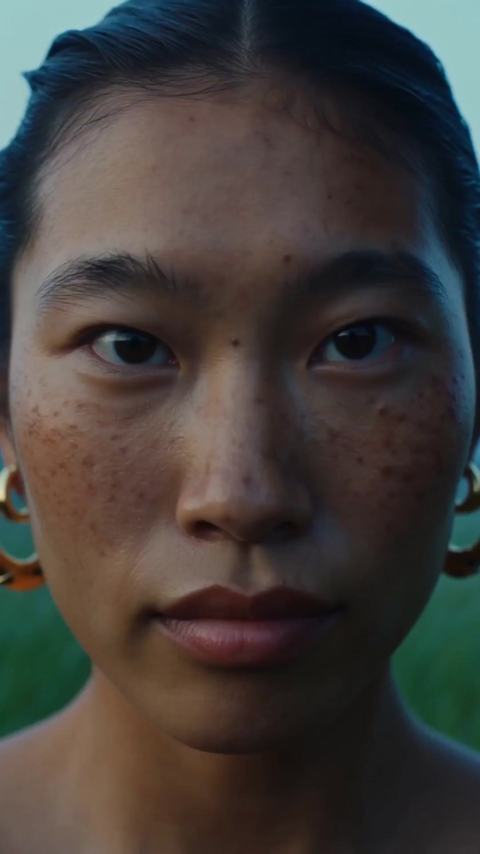 a close up of a person with freckles on her face