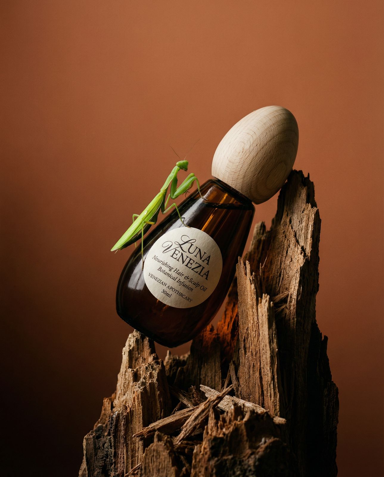 a bottle of liquid with a green insect on top of it