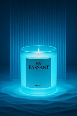 a lit candle sitting on top of a table
