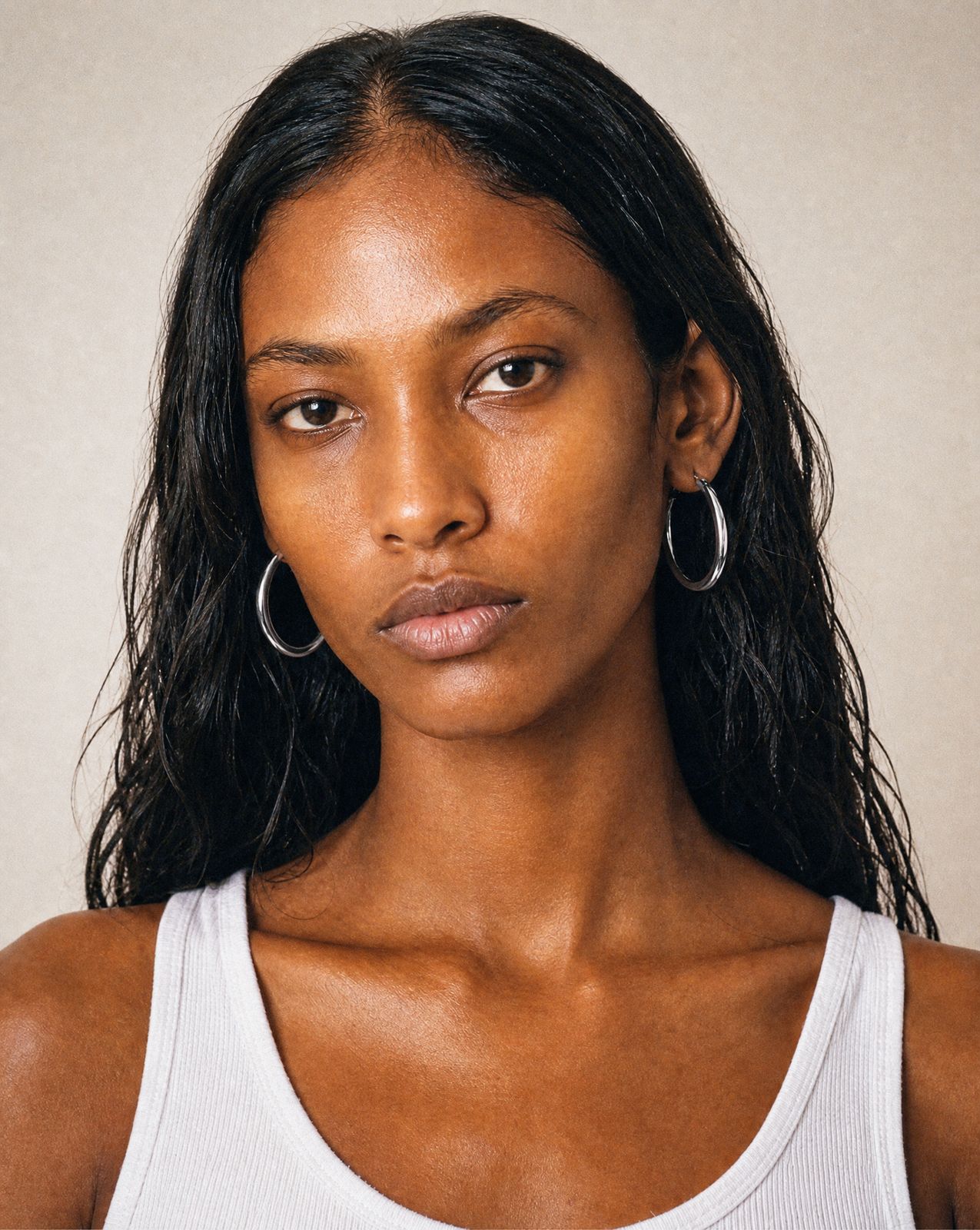 a close up of a person wearing a tank top