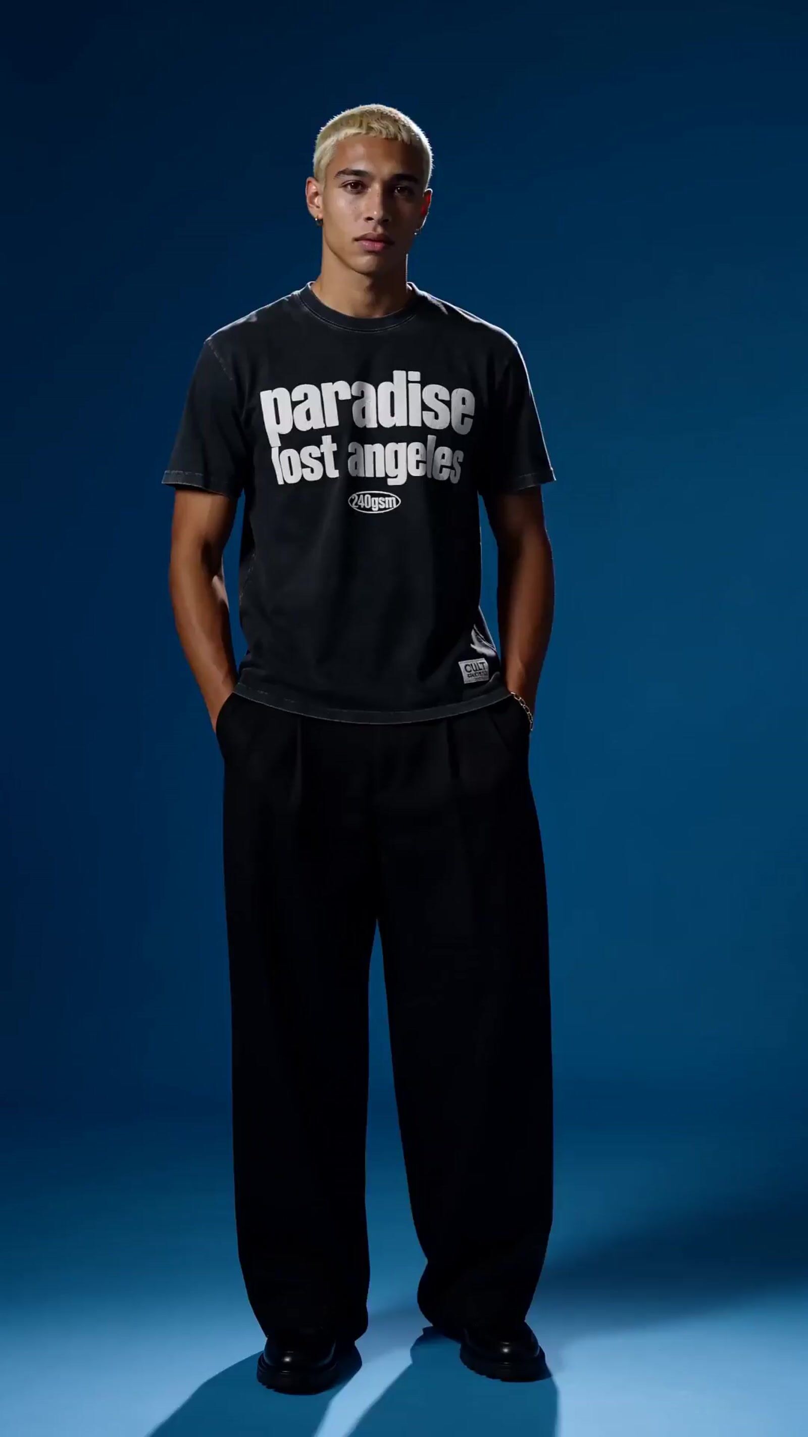 a man in a black shirt and black pants