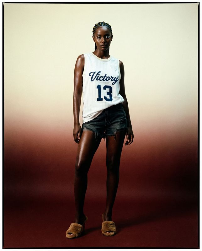 a woman in a white shirt and black shorts