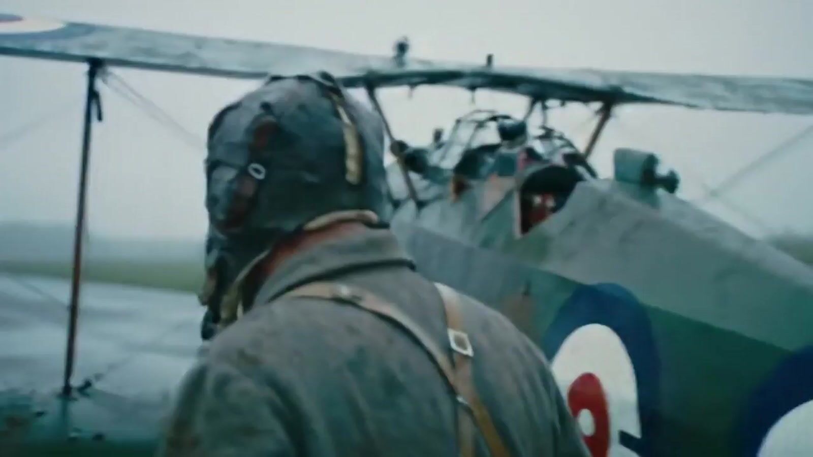 a man standing in front of an airplane