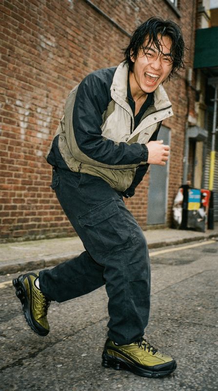 a man riding a skateboard down a street