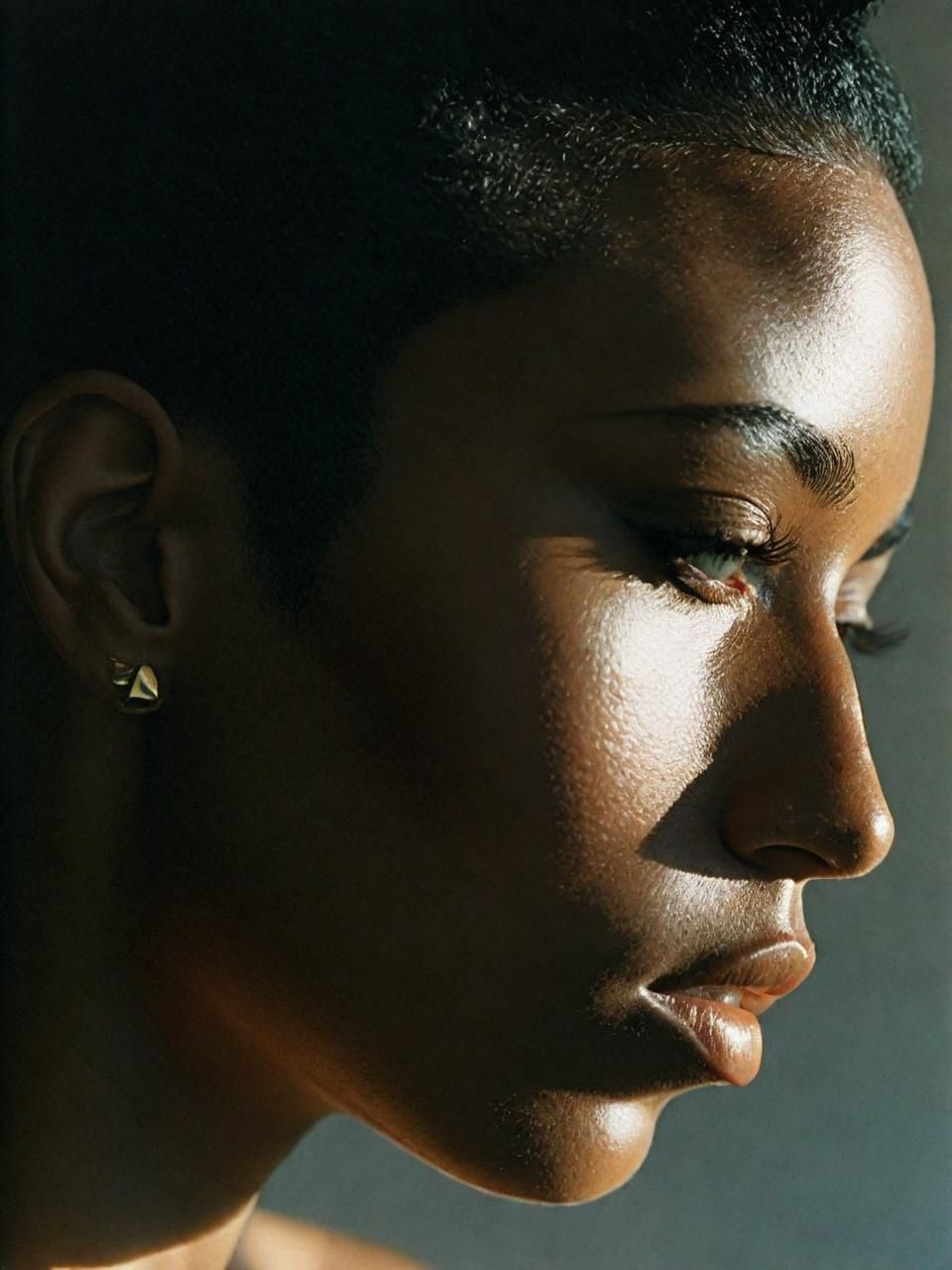 a close up of a person wearing a earring