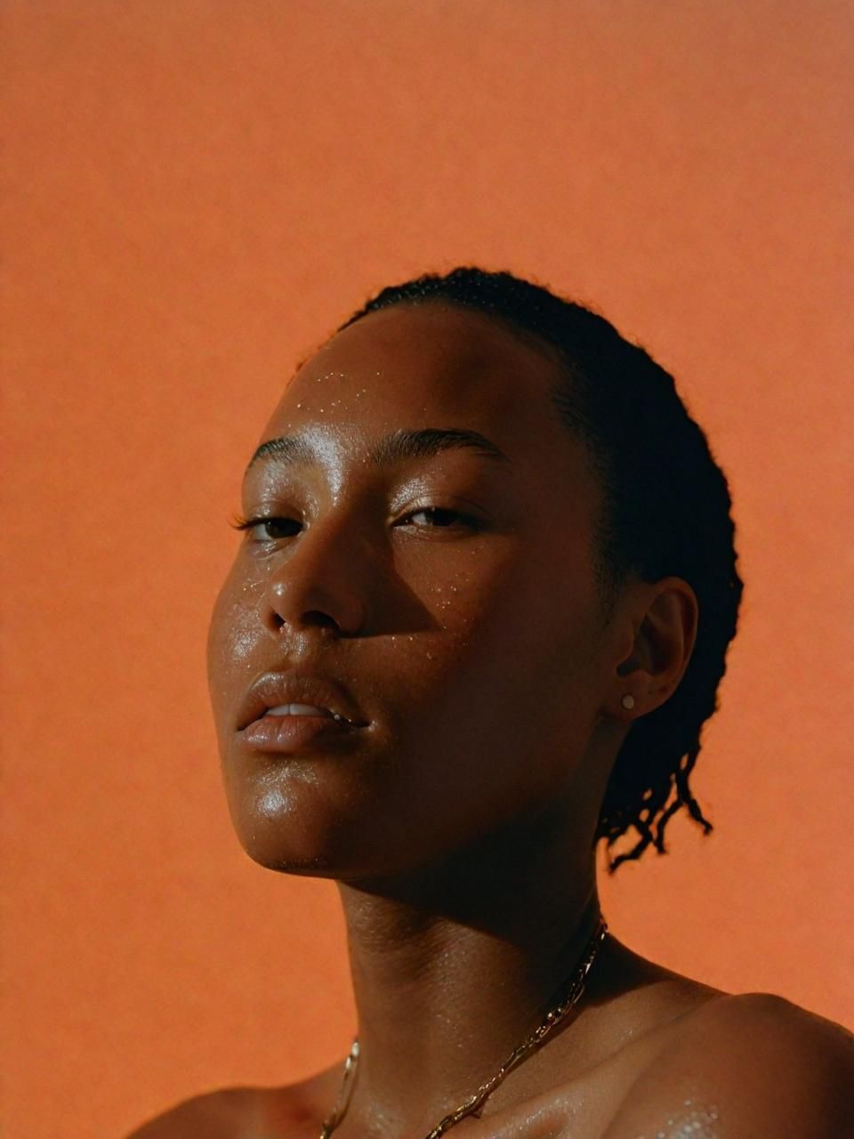 a close up of a person wearing a necklace