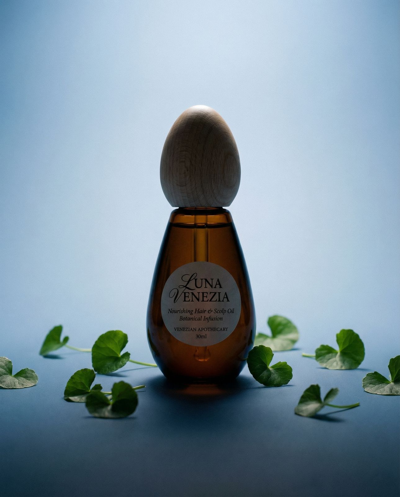 a bottle of honey with leaves around it