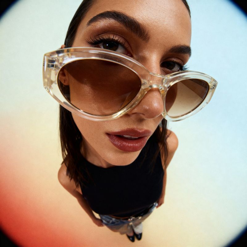 a woman wearing a pair of clear glasses