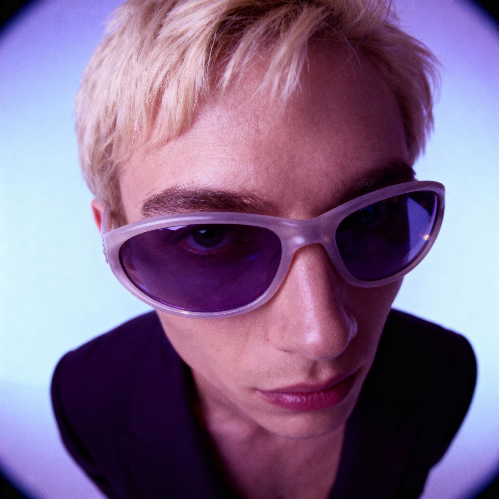 a person with a pair of sunglasses on their face