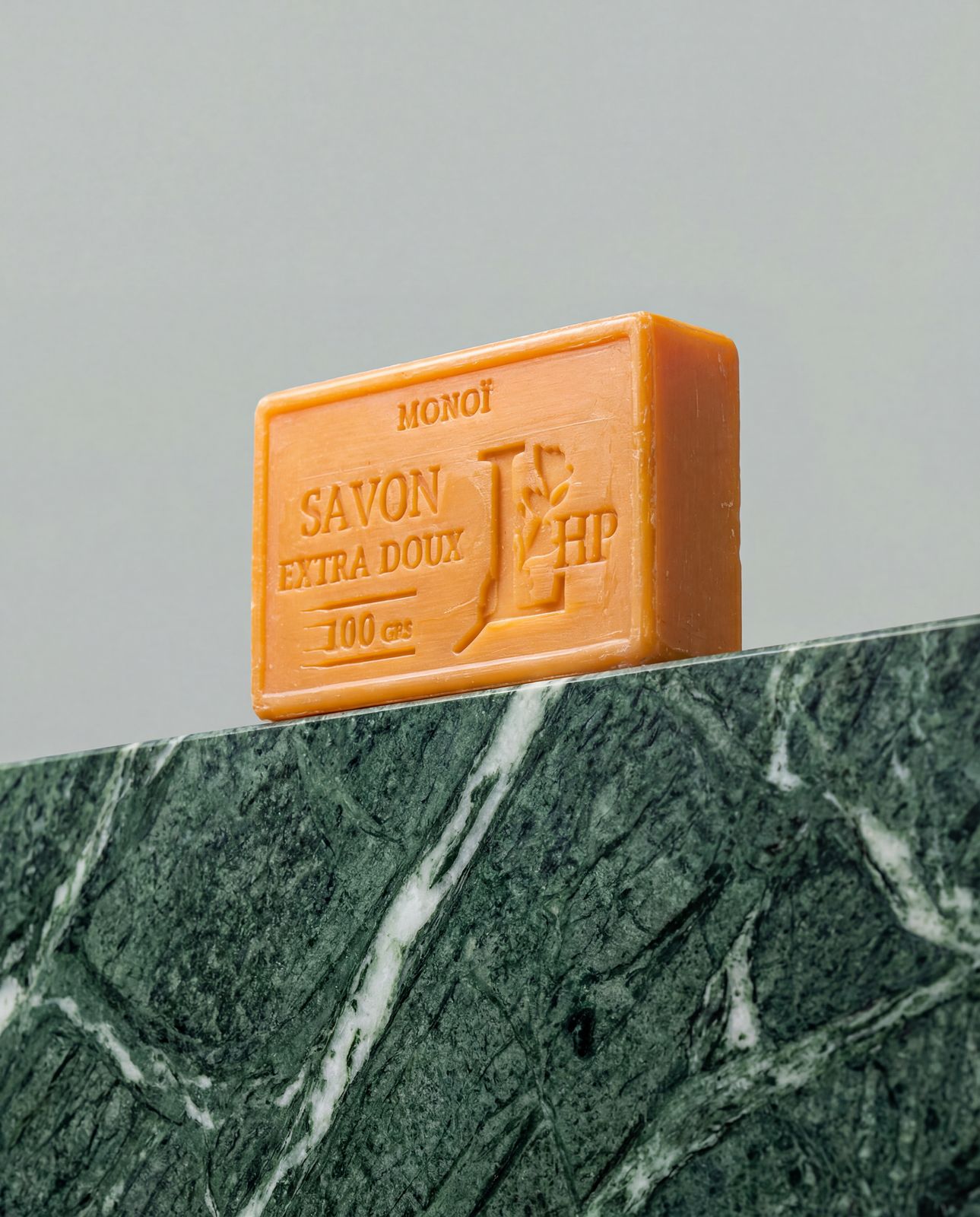 a bar of soap sitting on top of a marble counter