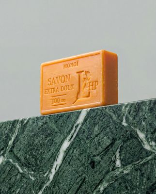 a bar of soap sitting on top of a marble counter