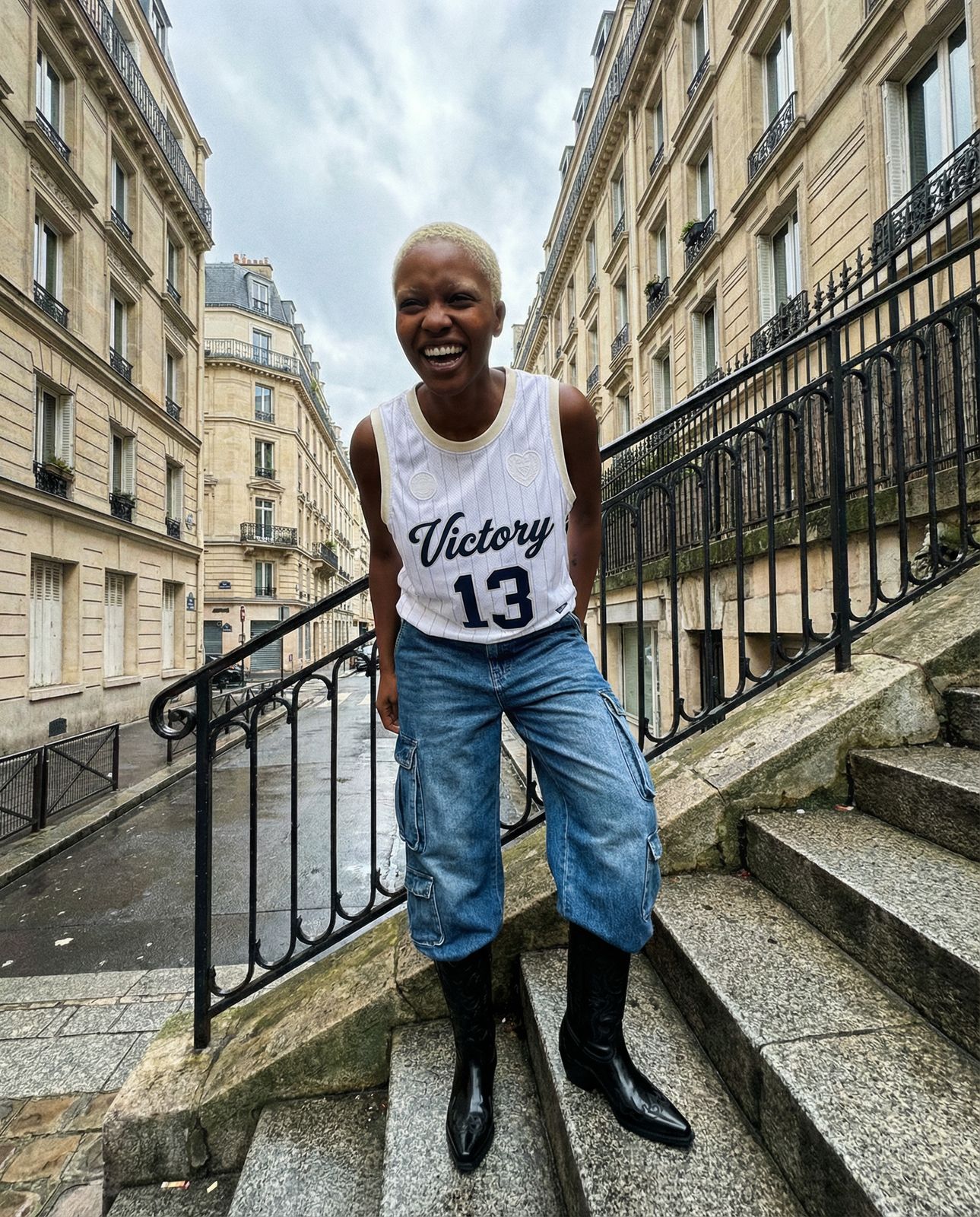 a person standing on some steps in front of some buildings