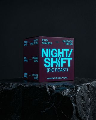 a purple box sitting on top of a rock