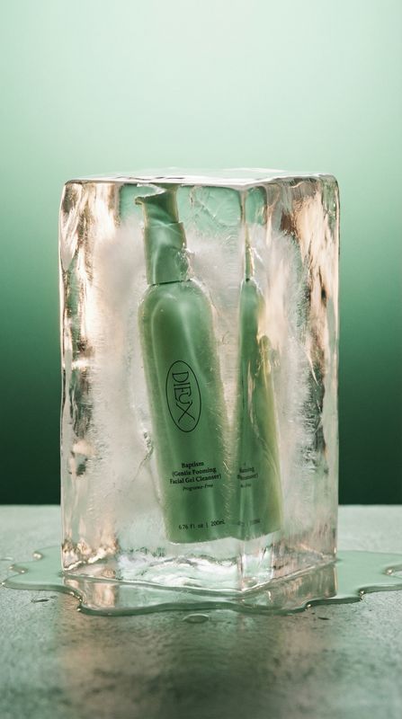 a bottle of aloey sitting on top of an ice block