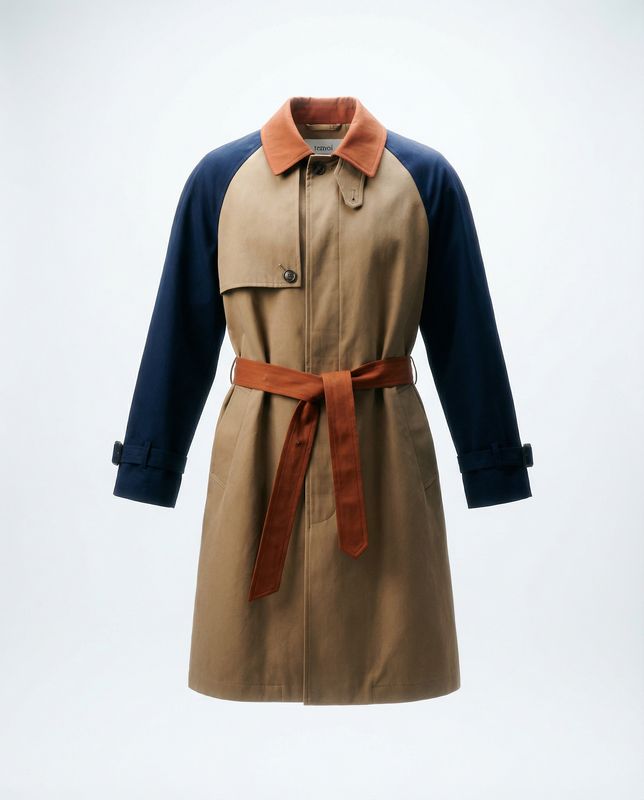 a trench coat with a brown belt and blue sleeves
