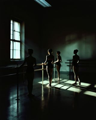 a group of women standing next to each other in a dark room