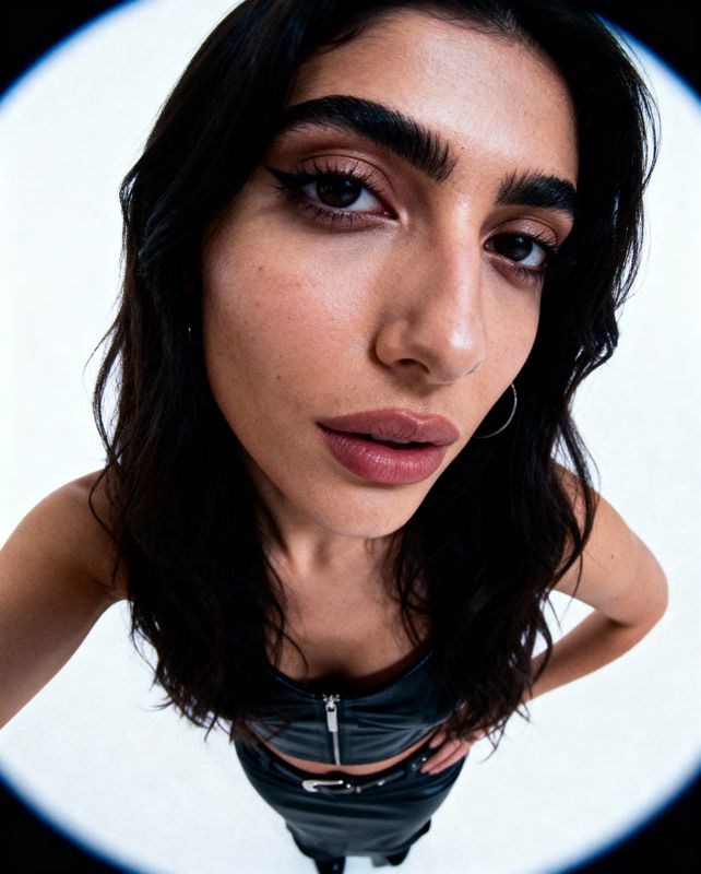 a close up of a person wearing a necklace