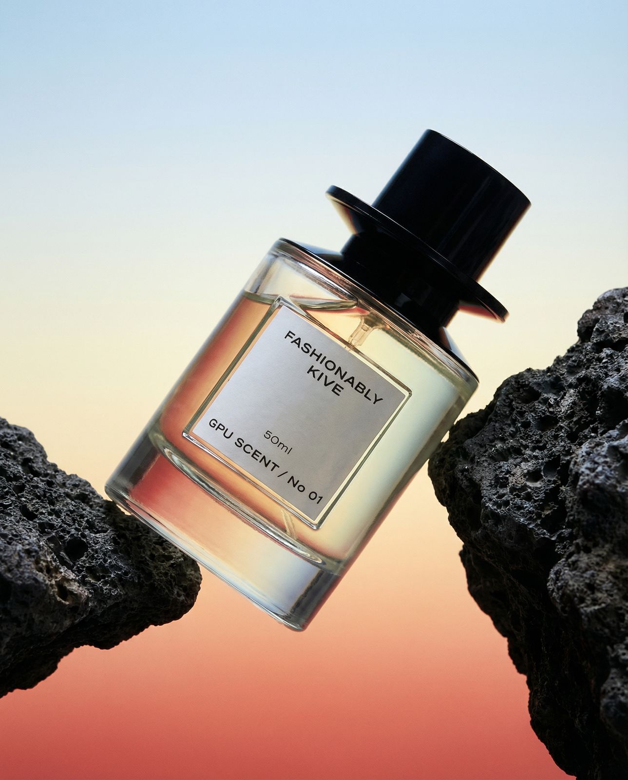 a bottle of perfume sitting on top of a rock
