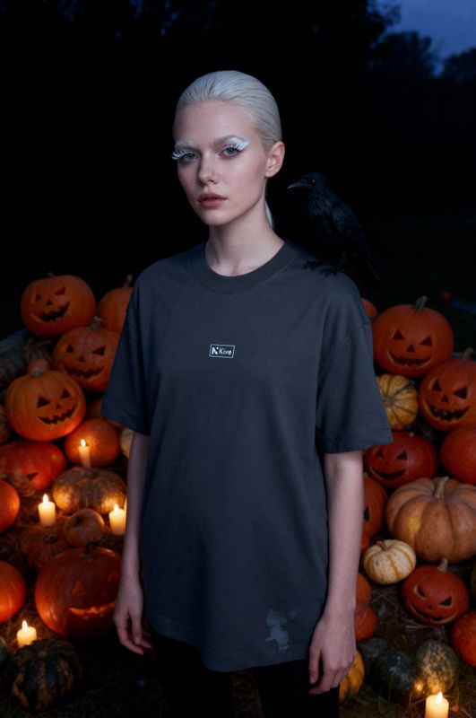 a woman standing in front of a pile of pumpkins