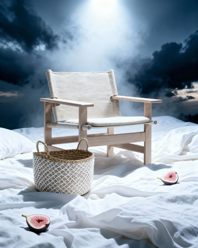 a chair and a basket sitting on a bed