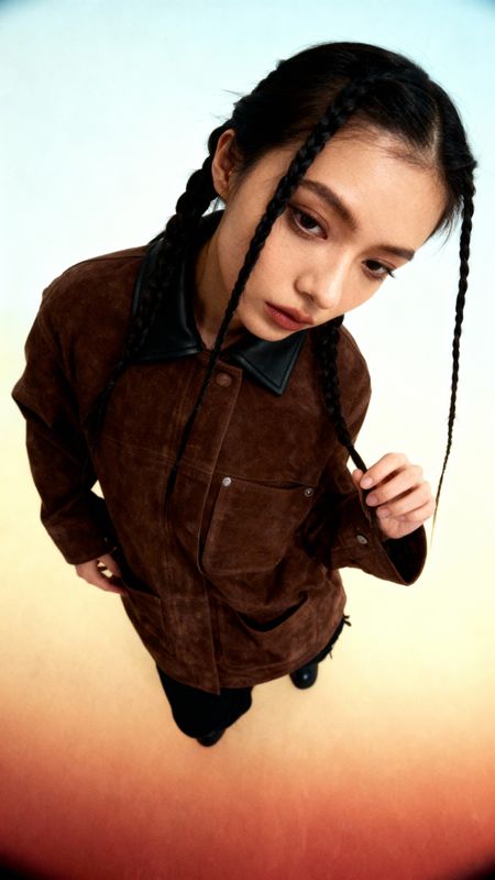 a young girl with braids on her hair