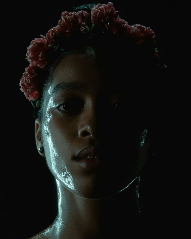 a woman with a flower in her hair