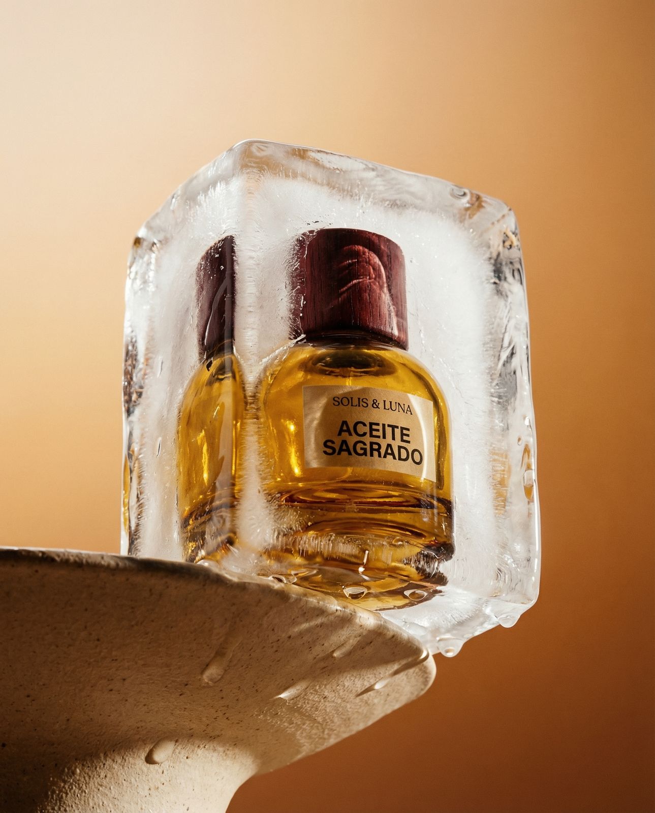 a couple of bottles of perfume sitting on top of an ice block
