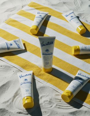sunscreens and sunscreens laid out on a towel