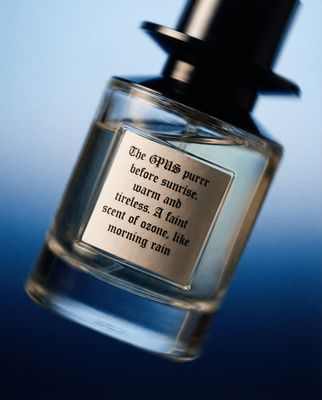 a bottle of cologne sitting on top of a table