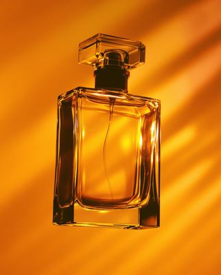 a bottle of perfume sitting on top of a table