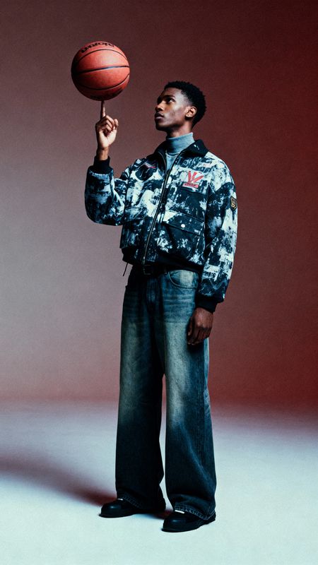 a man holding a basketball in his right hand