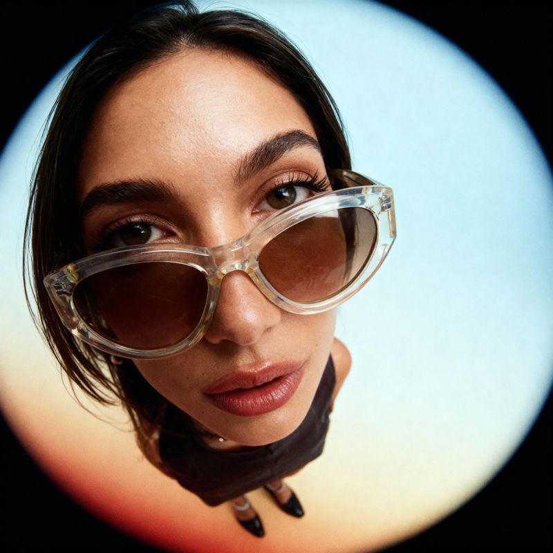 a woman wearing a pair of large sunglasses