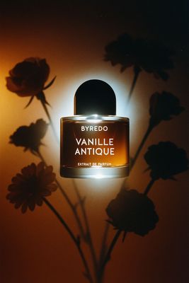 a bottle of perfume sitting on top of a table