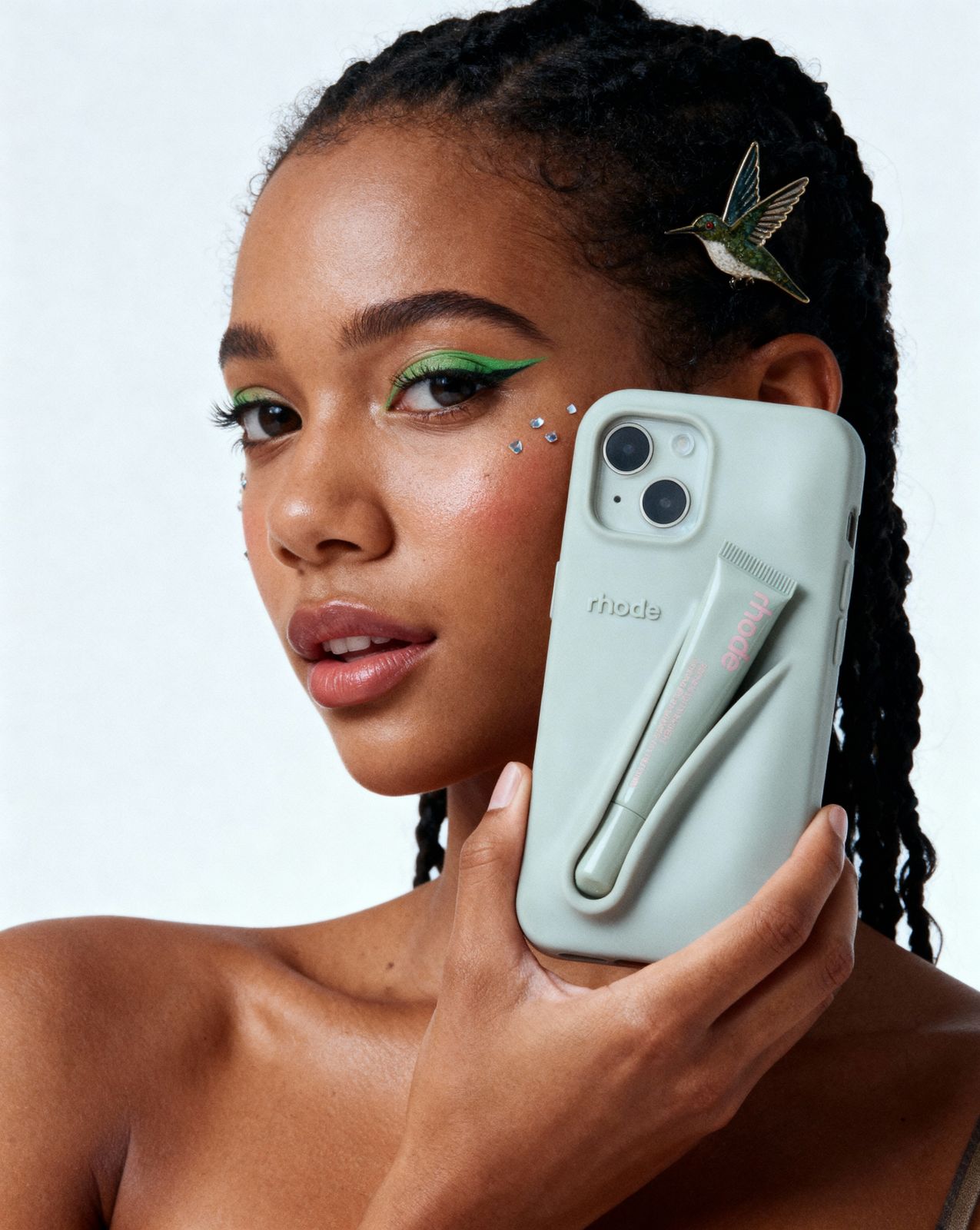 a woman holding a cell phone up to her face