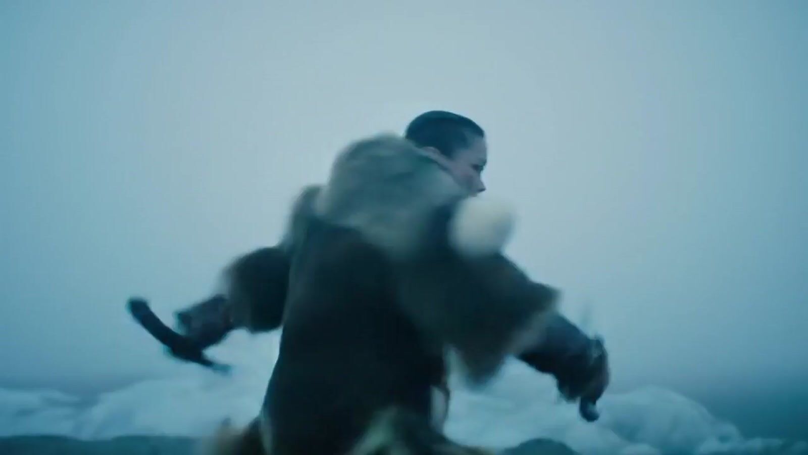 a blurry image of a man holding a snowboard