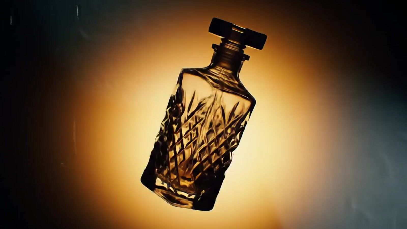 a glass bottle that is sitting on a table