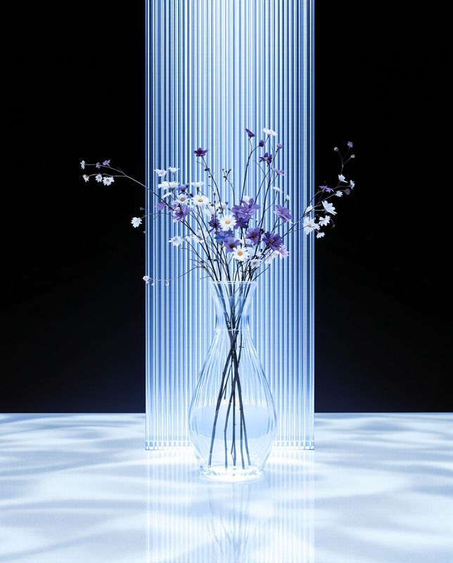 a vase filled with purple and white flowers