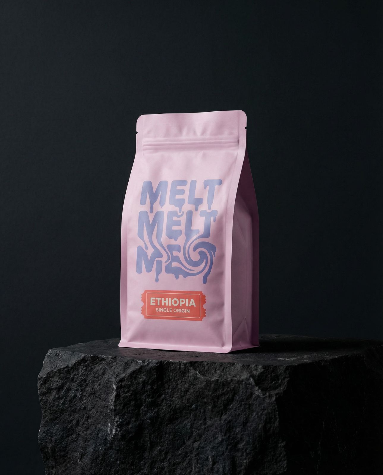 a bag of coffee sitting on top of a rock