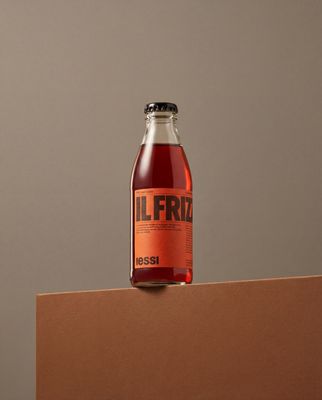 a bottle of liquid sitting on top of a box