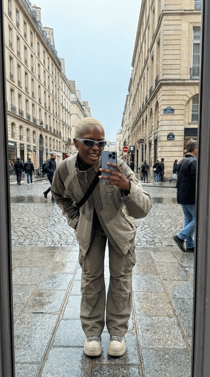 a man taking a picture of himself in a mirror