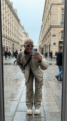 a man taking a picture of himself in a mirror