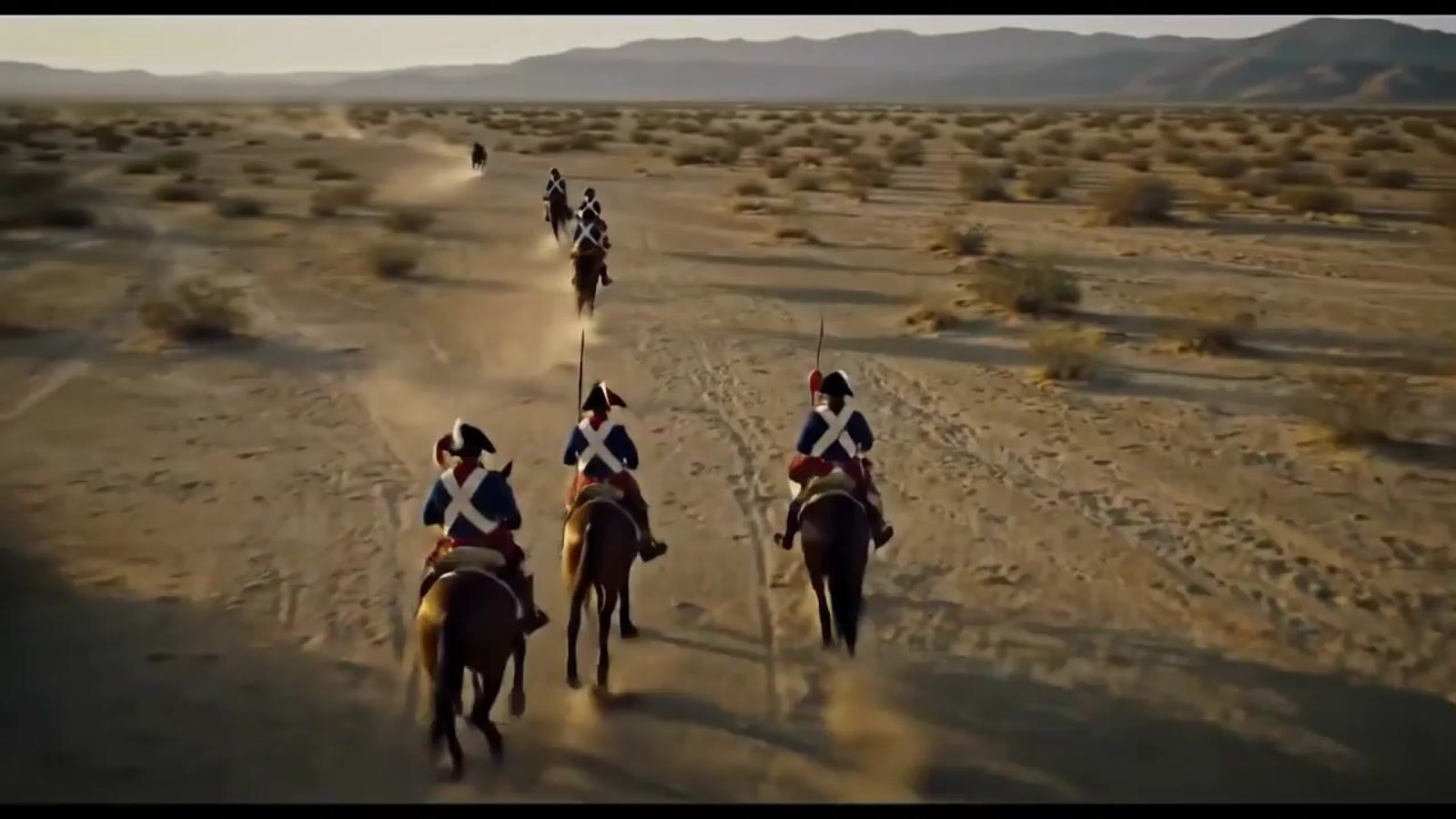 a group of people riding on the backs of horses