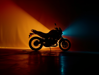 a motorcycle parked in front of a bright light