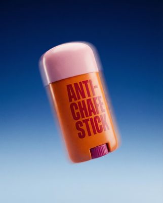 a bottle of anti - chafe stick flying through the air