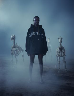 a man standing in front of a group of skeletons