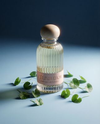 a bottle of perfume sitting on top of a table