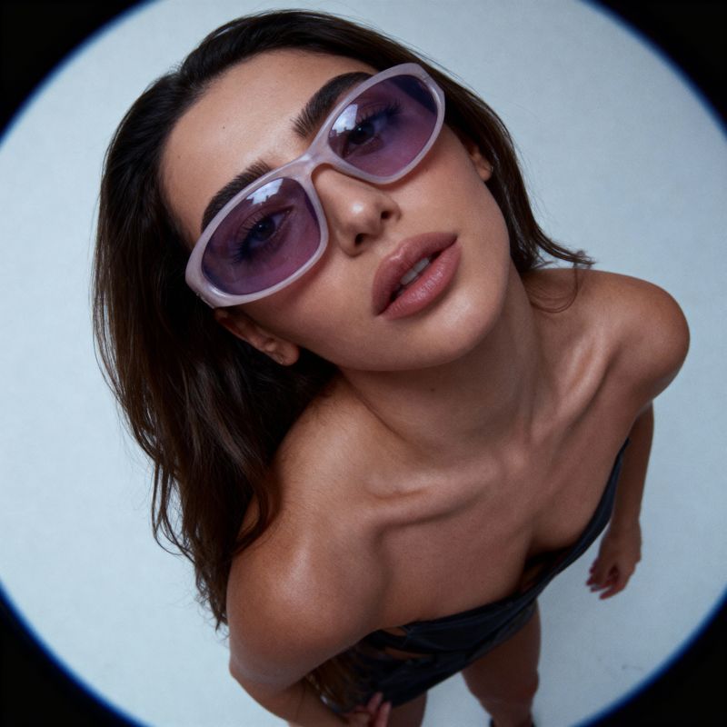 a woman in a bathing suit and sunglasses